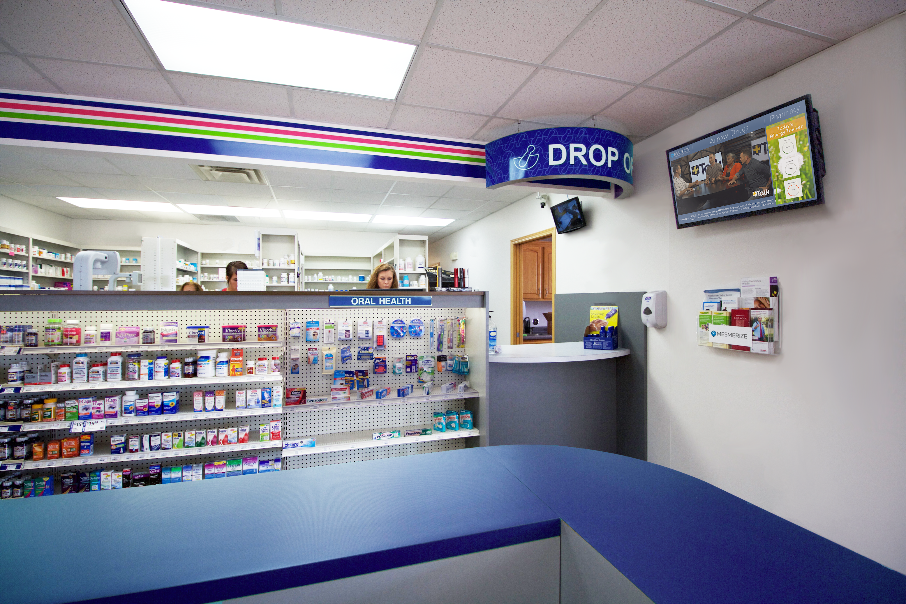Digital screens in retail pharmacies facilitate conversations between patients and pharmacists.