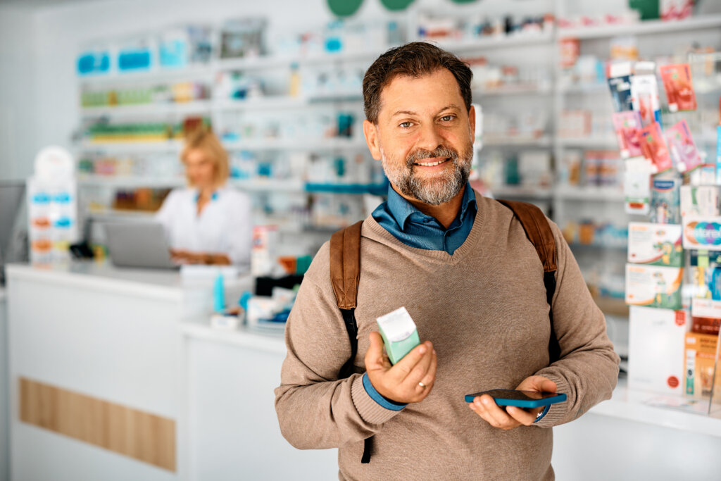 Patient at the pharmacy with medication and online patient support