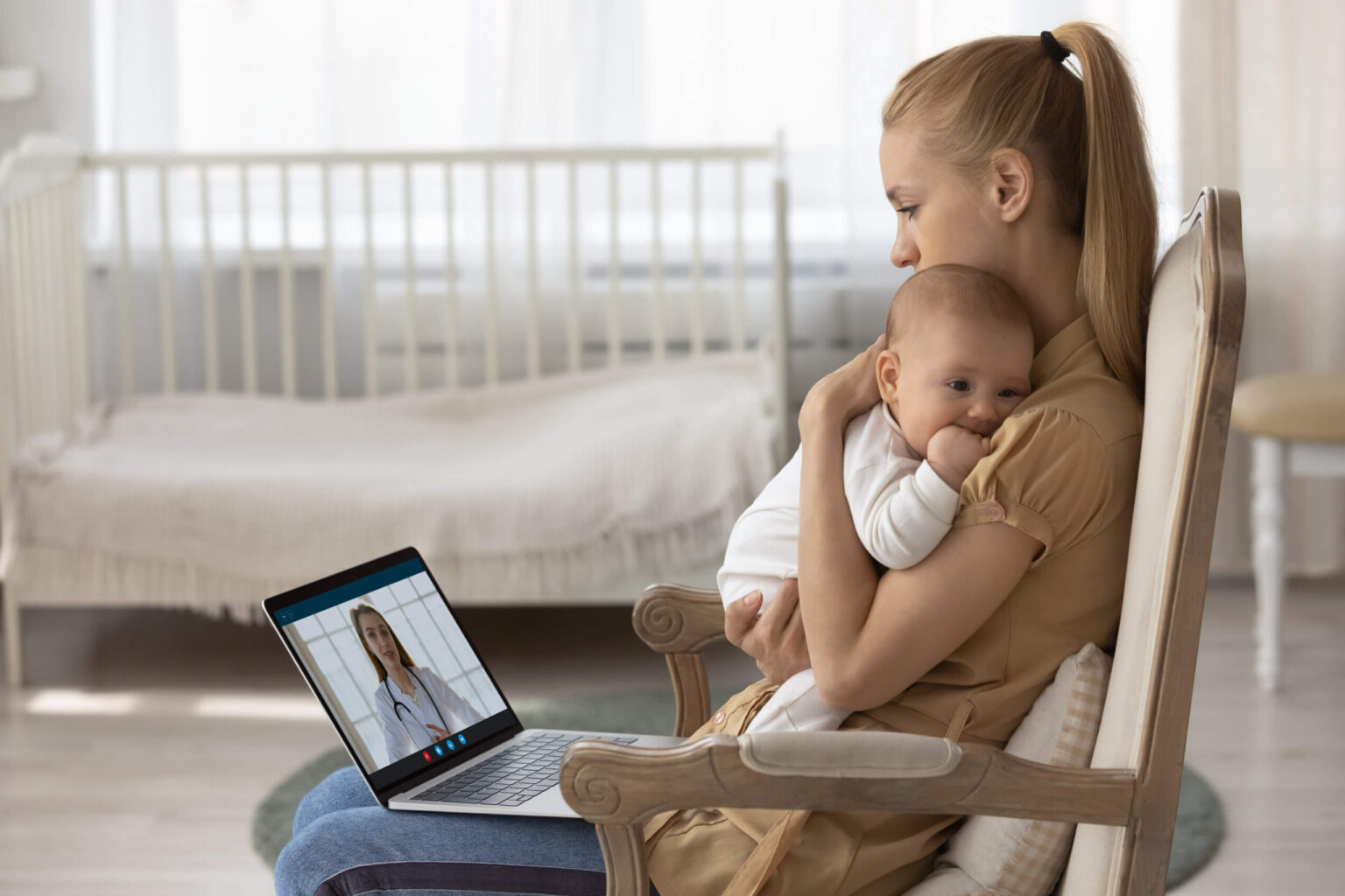 Young mother having a virtual care telehealth appointment