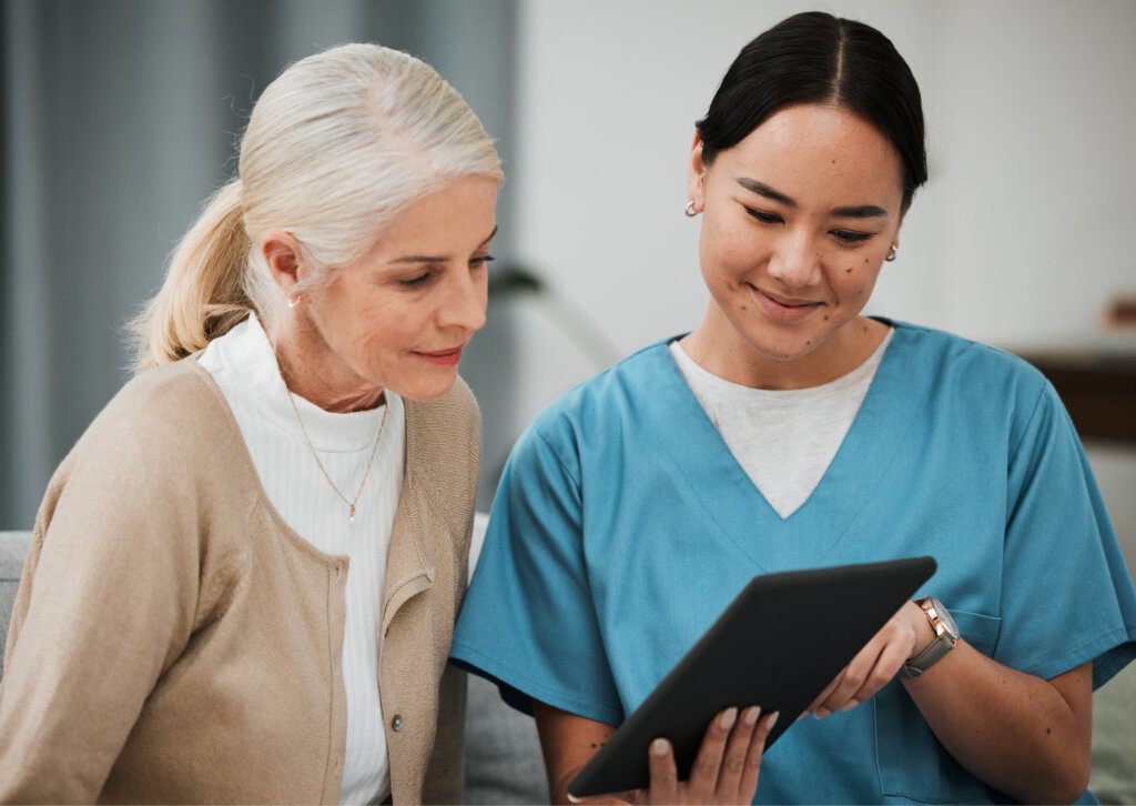 Female nurse show point of care patient education materials to patient