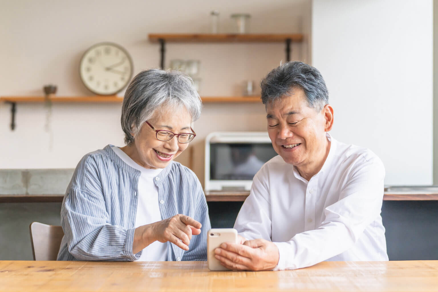 Older asian couple searches online for digital health information. caretakers and healthcare consumers.