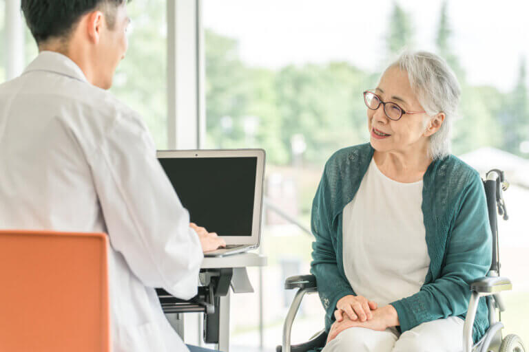 Doctor with EMR talks to patients